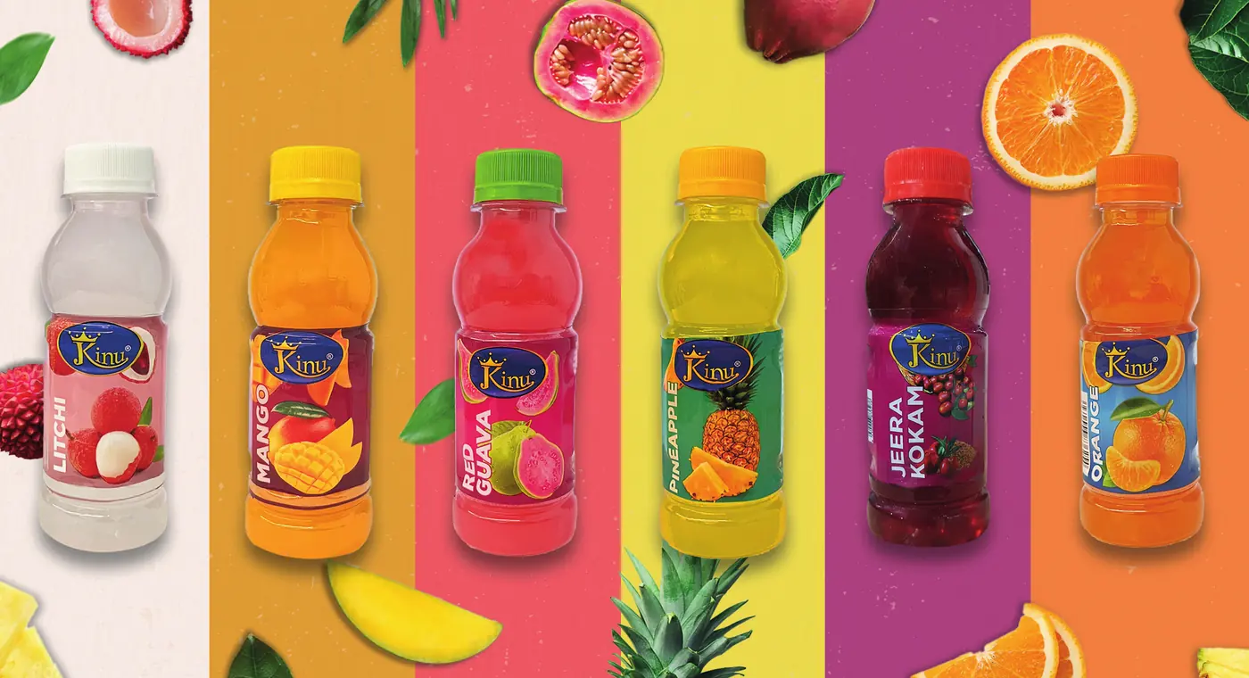 The six Kinu bottles on colourful stripes with fruit